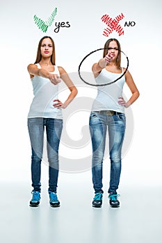 Conceptual portrait of two beautiful twin young women