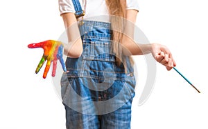 Conceptual shot of child with colorful painted hands