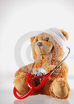 Conceptual Sick Teddy Bear with Stethoscope Device