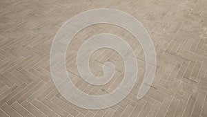 Conceptual solid beige background of concrete tiles texture floor as a modern pattern layout.