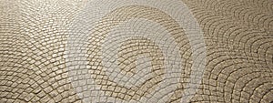 Conceptual solid beige background of wave cobblestone texture floor as a modern pattern layout.