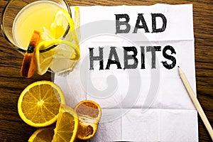 Conceptual text caption showing Bad Habits. Concept for Improvement Break Habitual Hebit written on tissue paper on the wooden bac