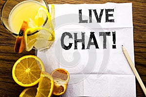 Conceptual text caption showing Live Chat . Concept for Communication Livechat written on tissue paper on the wooden background wi photo