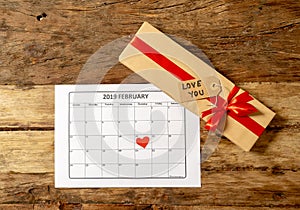 Conceptual Valentines image of note book with space for text, heart shaped chocolates and coffee