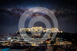 Conceptual view to the illuminated Acropolis of Athens under a starry sky with the milky way