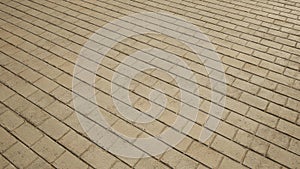 Conceptual vintage or grungy beige background of bare brick texture floor as a retro pattern layout.