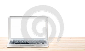 Conceptual workspace or business concept. Laptop computer with blank white screen on light wooden table. Isolated background.