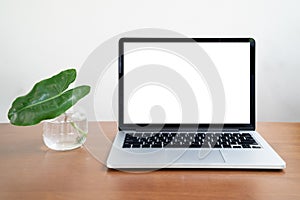 Conceptual workspace, Laptop computer with blank white screen on white background