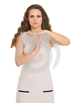 Concern young woman showing stop gesture