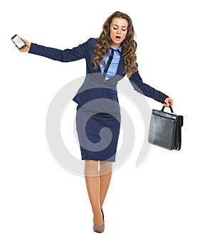 Concerned business woman balancing on dangerous path