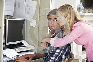 Concerned Couple In Home Office