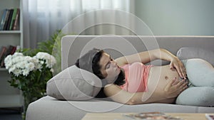 Concerned about her well-being and feelings pregnant woman groping her tummy