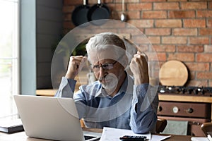 Concerned mature man feels stressed managing family budget