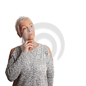 Concerned mature woman looking up