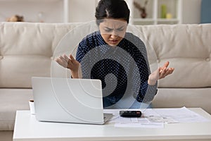 Concerned mixed race woman economist unable to balance accounts payable photo