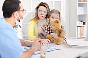 Concerned Mother in Doctors Office