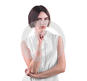 A concerned office lady isolated on a white background. Businesswoman in a thinking pose. A beautiful and strict young woman.