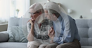 Concerned senior husband consoling frustrated desperate mature