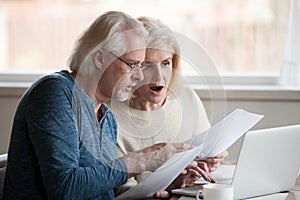 Concerned aged couple shocked by information online photo