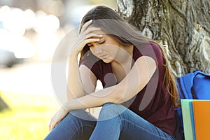 Concerned student lamenting outdoors