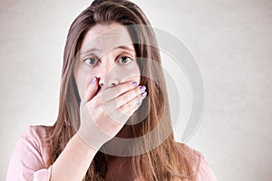 Concerned Woman Covering Mouth