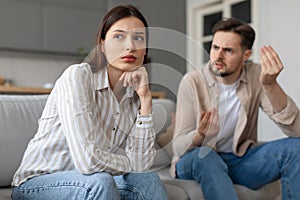 Concerned woman ignoring man's explanation