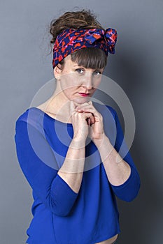 Concerned woman with retro look expressing loneliness