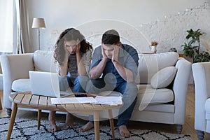 Concerned worried married couple getting financial problems photo
