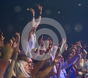 Concert, audience and music with happy woman in group at dj, band and festival event at a stage with lights. Rock show
