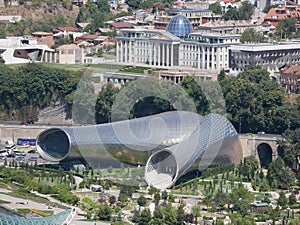 Concert hall tube and President palace in Tbilisi in Georgia country - zoom in cityscape