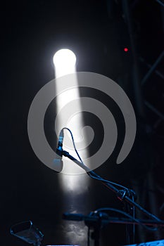 Concert lights, stage, show and excitement.  Light spots in concert, outdoor stage at night, foggy electricity.