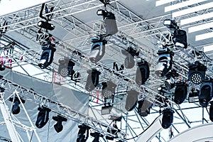 Concert stage lighting equipment. Metal structure with a canopy and various spotlights. Bottom up view. Selective focus