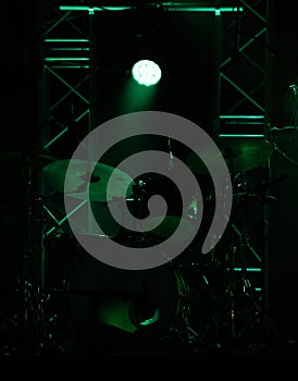 concert stage on rock festival, music instruments drum silhouettes, colorful background