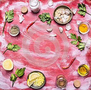 Concert vegetarian food Red pepper garlic salt grated lemon herbs oil on red rustic wooden background top view