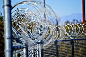 Concertina Wire Stretched Over A Fence photo