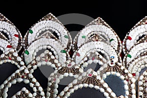 Conch shells at Puri sea beach evening market. Mirror on black background.