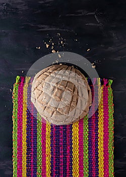 Concha Vanilla Bread, Mexican Sweet Scone on Woven Tablecloth.