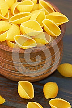 Conchiglioni italian pasta in wood bowl