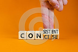 Concise or consistent symbol. Businessman turns wooden cubes and changes concept word Concise to Consistent. Beautiful orange