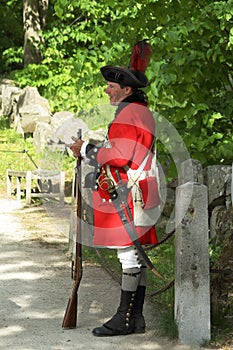 A man in uniform of a British soldier of Revolutionary War in Minute Man National Historical Park