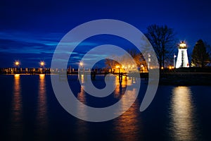 Concord Point Lighthouse and a pier at night in Havre de Grace,