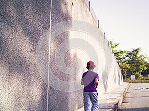 Concrete apartment area with child jogging and running in the morning