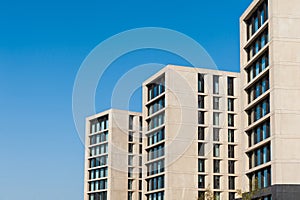 Concrete apartment buildings against blue sky