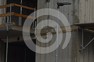 Concrete balcony with safety barriers and temporary work platforms