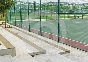 Concrete bench for spectators at futsal court.