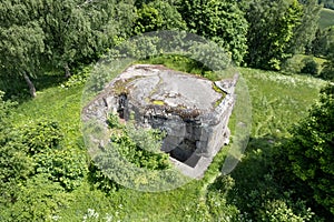 Concrete blockhouse in the meadows with trees. Mladkov. Czech republic.