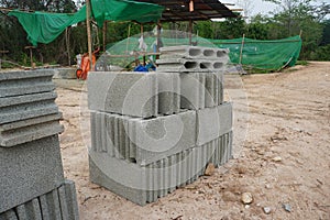 Stacked rectangular concrete blocks on the construction site. building materials.