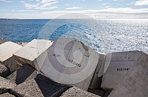 Concrete blocks numbered in the jetty of Los Cristiano photo