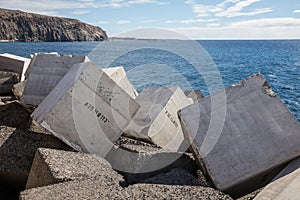 Concrete blocks numbered in the jetty of Los Cristiano photo