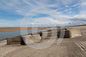 Concrete breakers on the beach at Leasowe Wirral June 2019